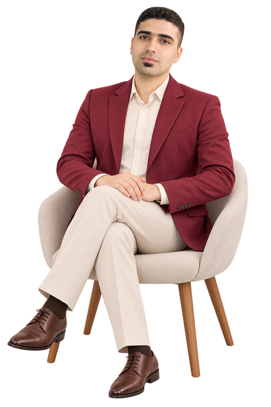 Daniel Rajabi seated in formal attire